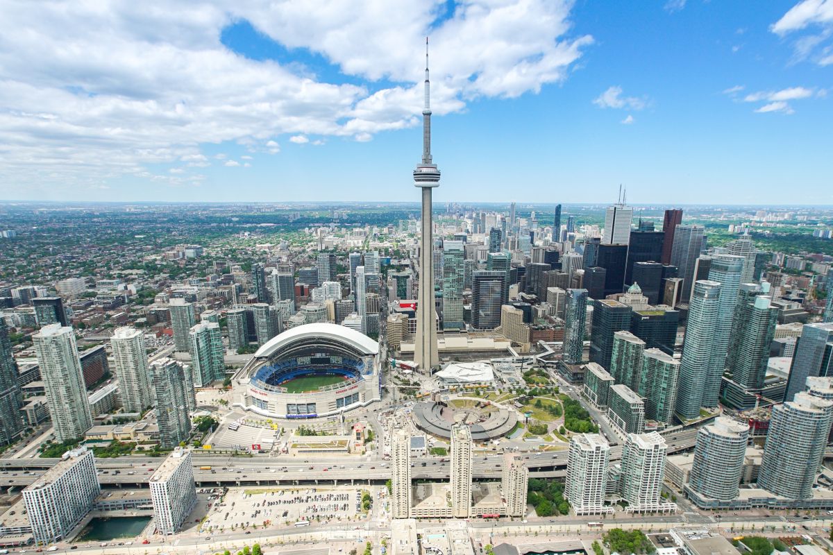 An aerial view of Toronto, showing the CN Tower and the Rogers Centre