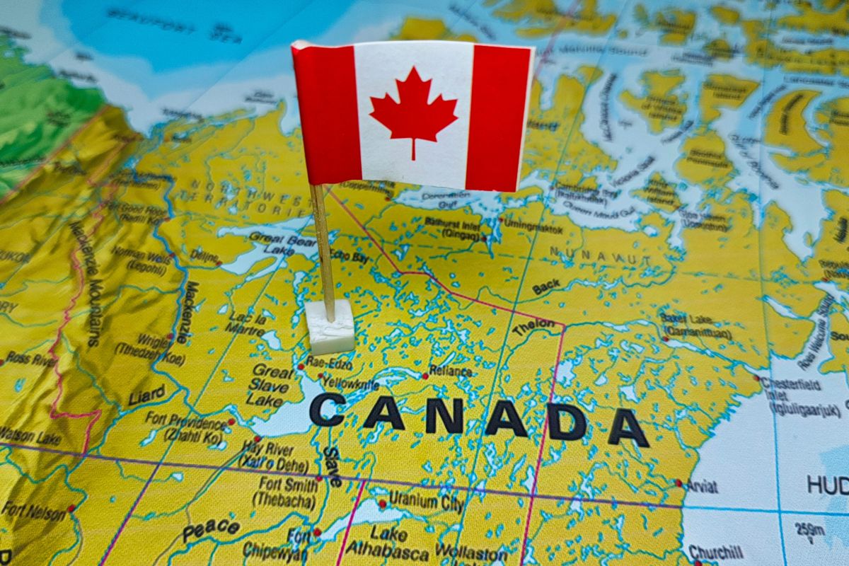 A map of Canada with the Canadian flag affixed
