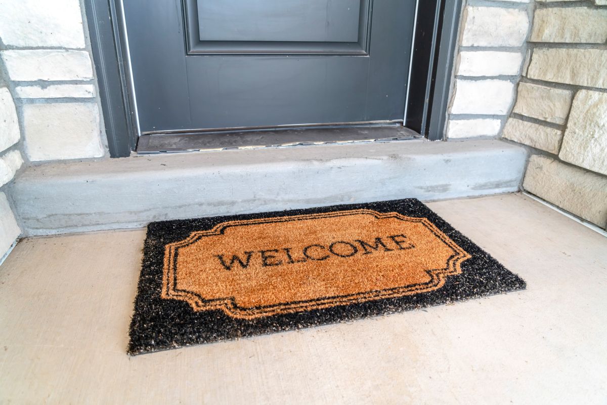 A welcome mat outside a front door