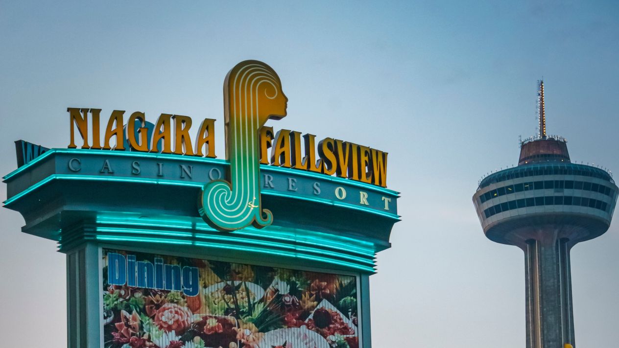 A sign for Niagara's Fallsview Casino with the Skylon Tower in the background