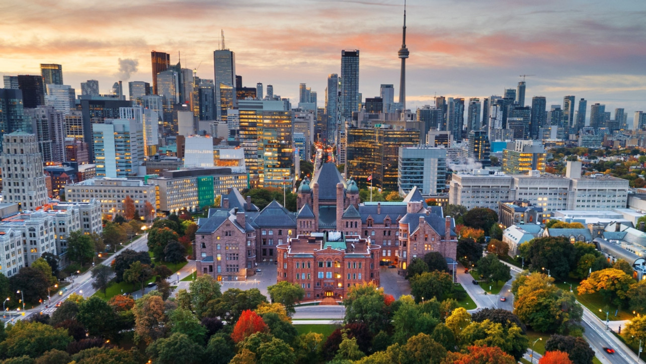 A photo of the Toronto skyline with the Legislative Assembly of Ontario in the foreground
