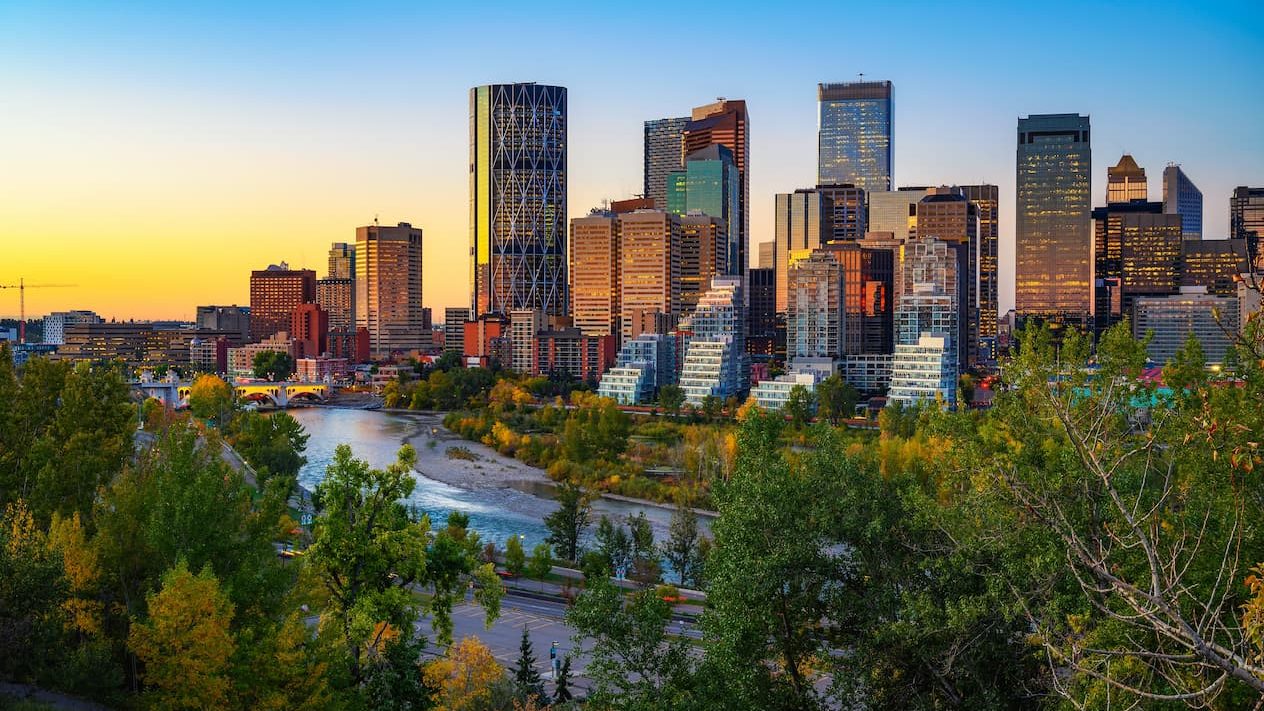 Sunset above city skyline of Calgary with Bow River, Alberta, Canada.