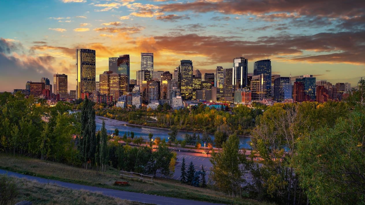 Sunset above city skyline of Calgary with Bow River, Alberta, Canada.