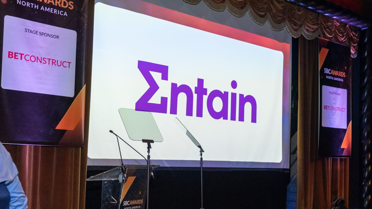 The logo for Entain, the parent company of Sports Interaction