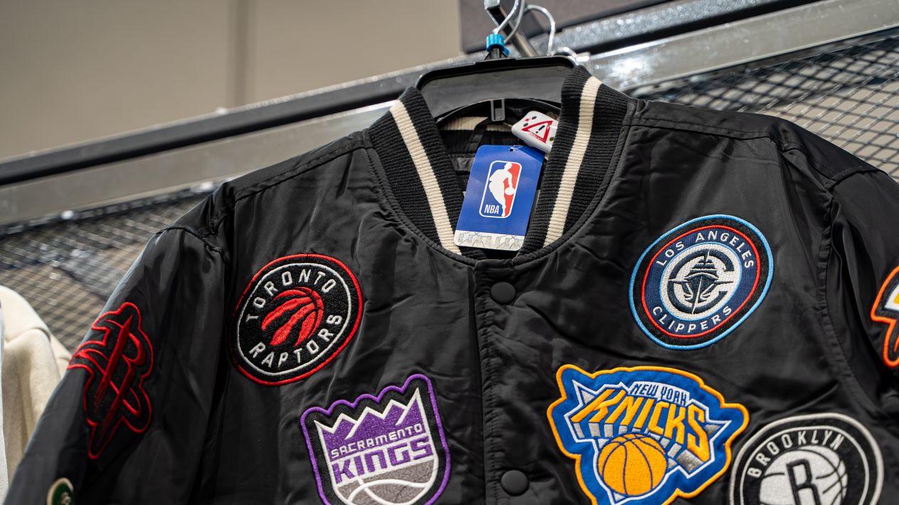An NBA jacket with a Toronto Raptors patch visible