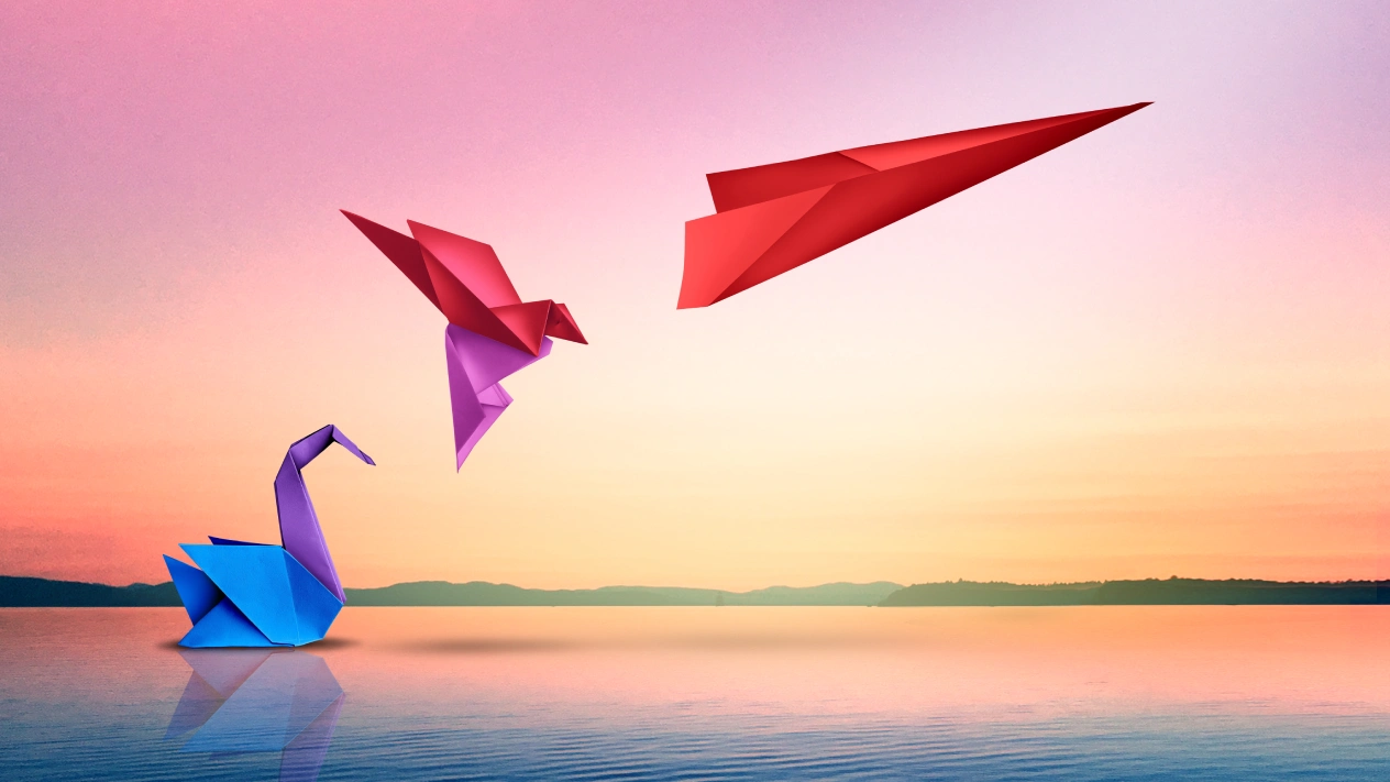 Origami birds evolve into a plane, illustrating the Canadian growth Kambi talks about.